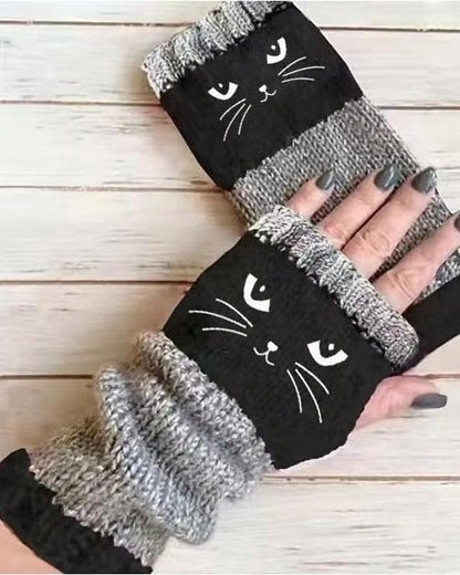 Black knit fingerless gloves with embroidered cat face