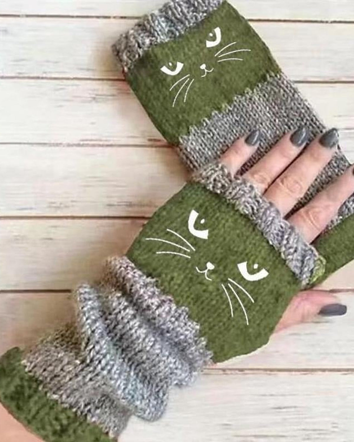 Green knit fingerless gloves with embroidered cat face