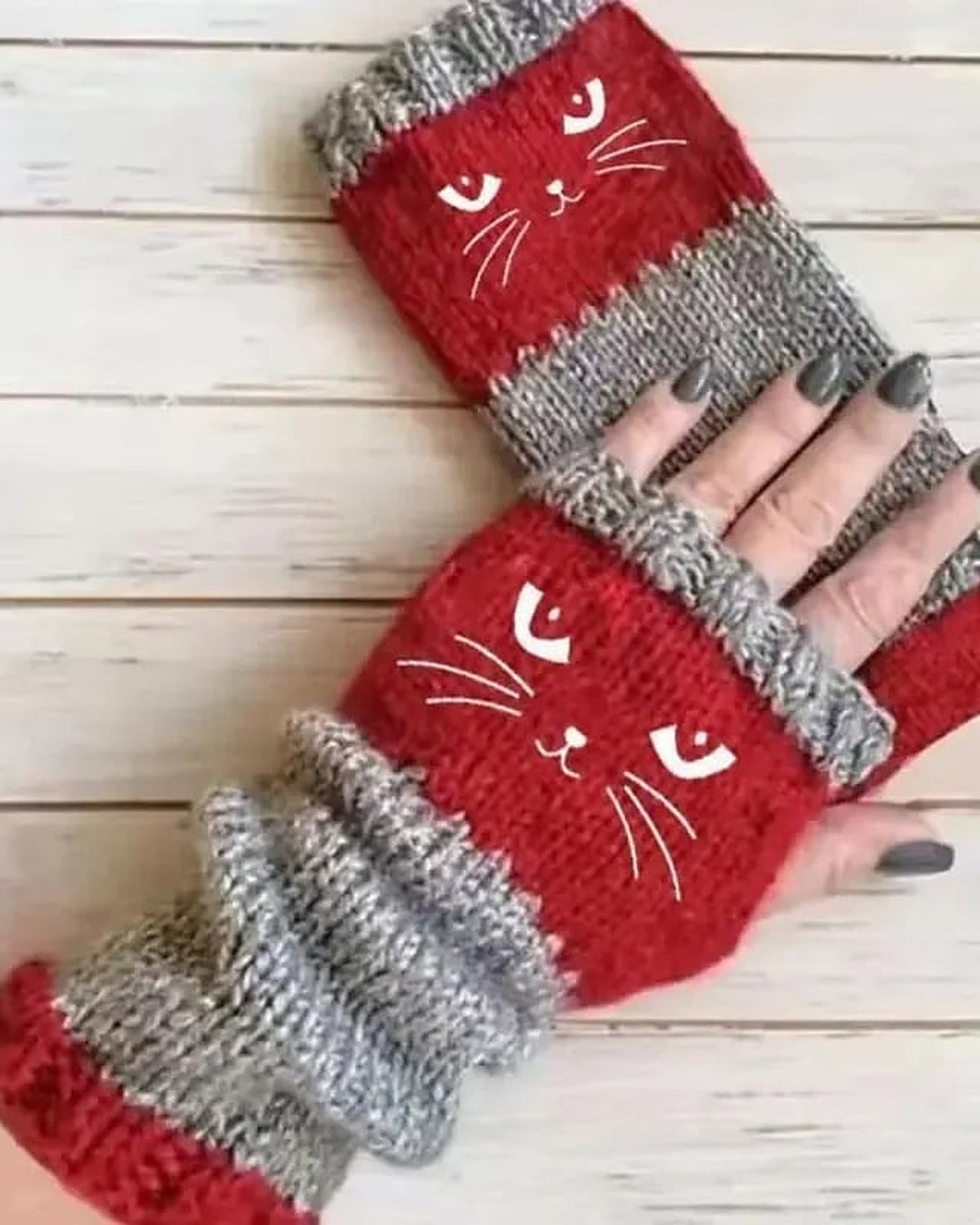 Red knit fingerless gloves with embroidered cat face