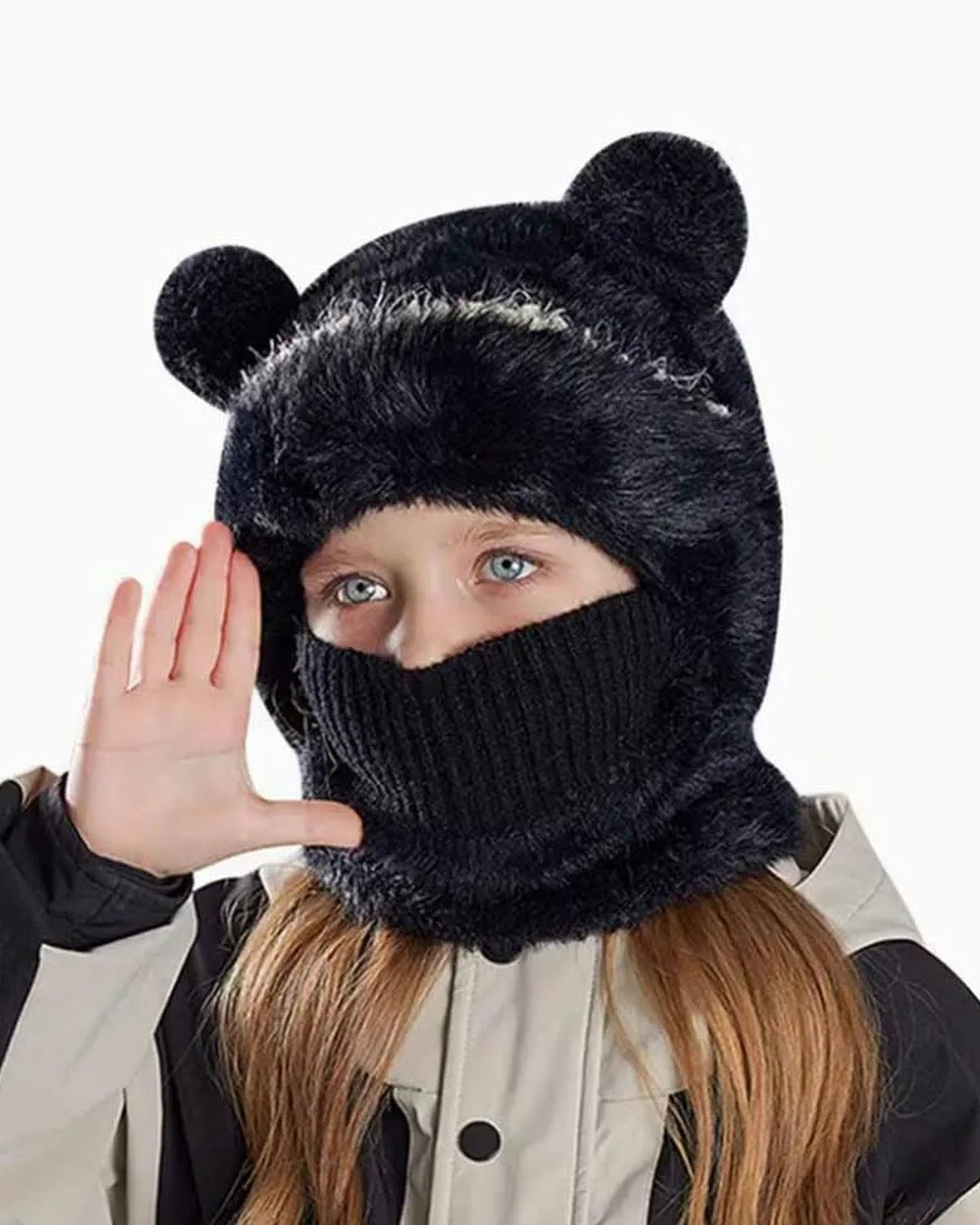 Girl wearing a black teddy bear hood with the knit face cover pulled up