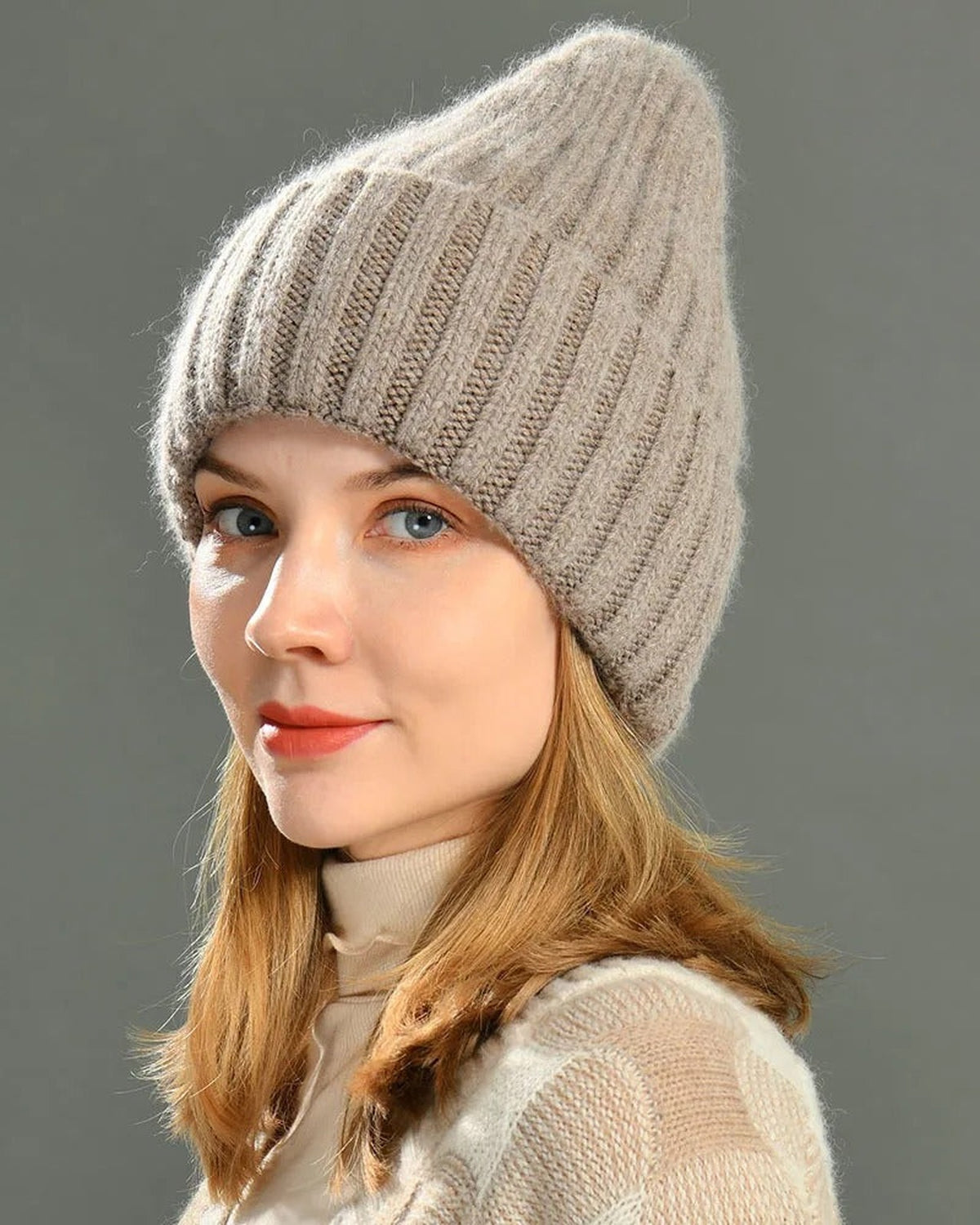 Woman wearing a brown satin-lined rib knit beanie