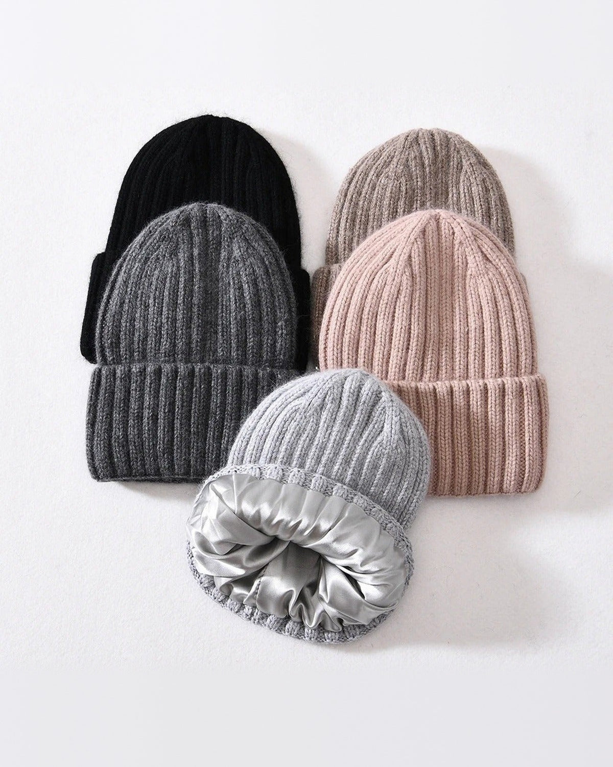 Black, dark gray, brown, blush and light gray satin-lined beanies, one turned to show the lining